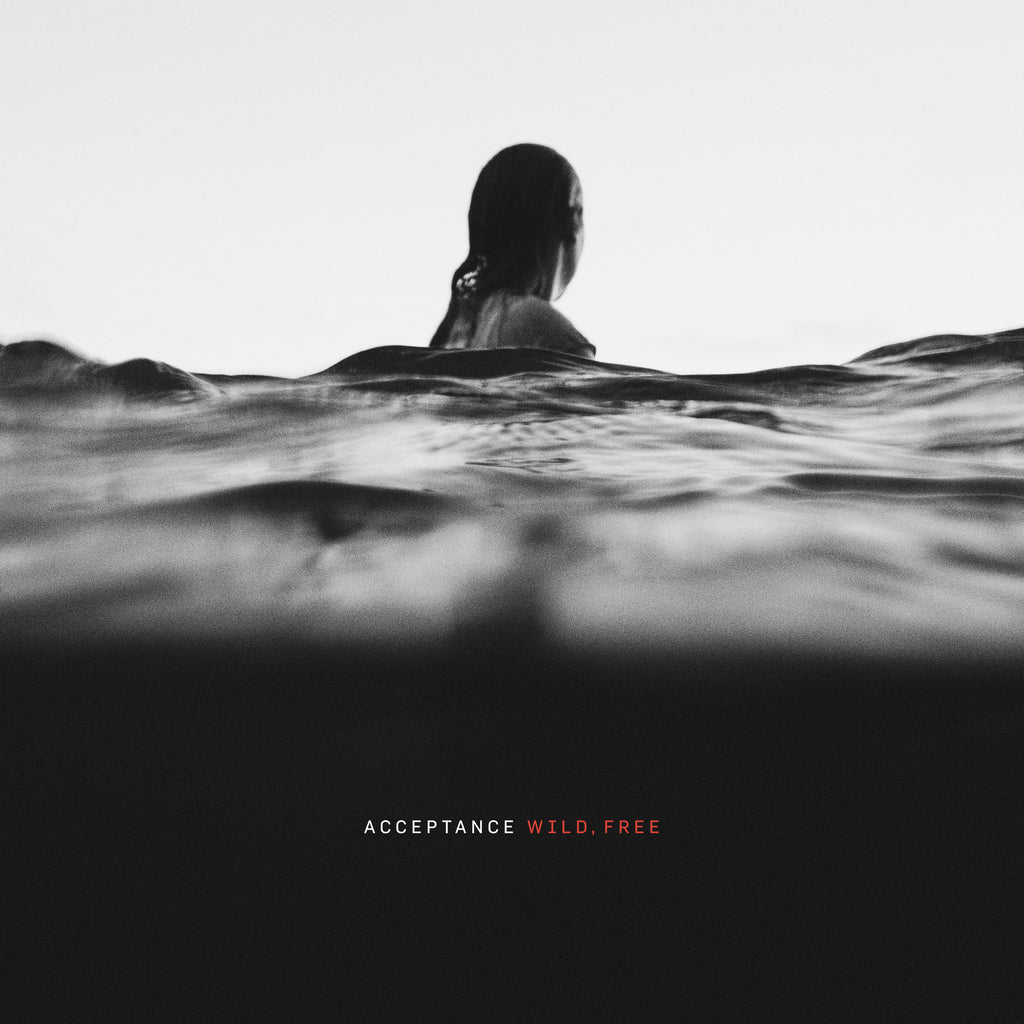 image of the cover of the wild, free album. it is a black and white photo of a woman in the water