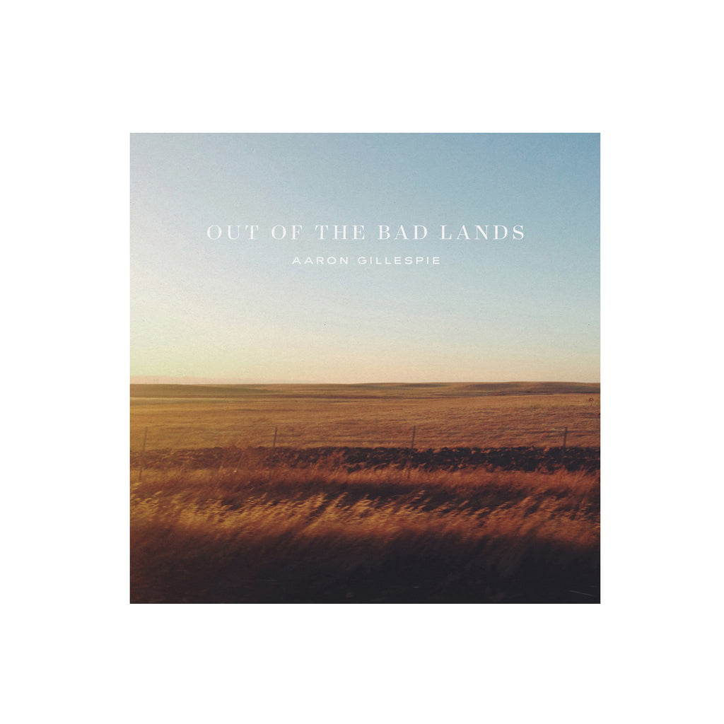 image of the cd cover for out of the badlands and shows a pitcure of a field at dusk
