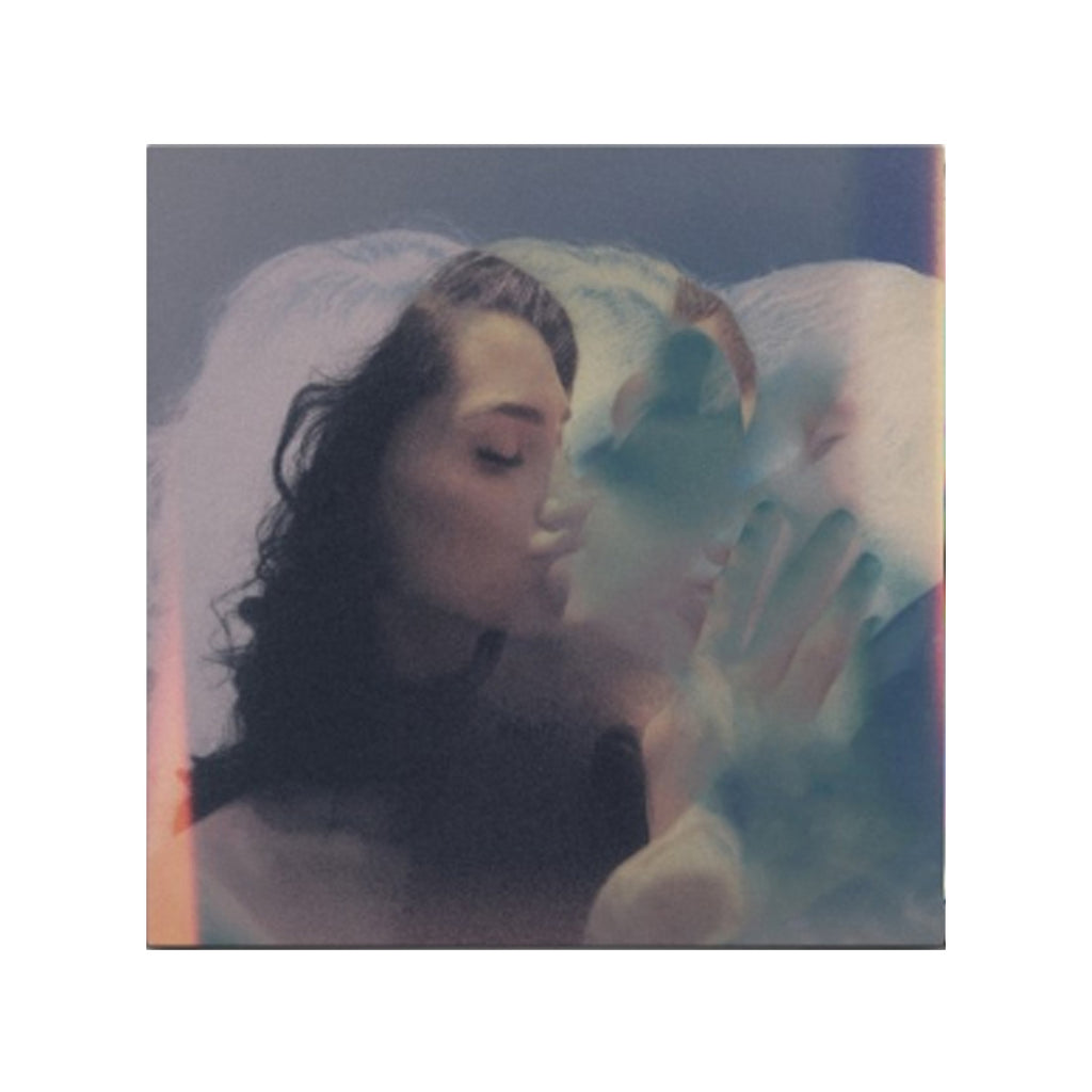 image of an album cover for blushing. image is of a man and a woman kissing