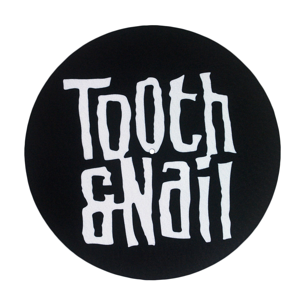 image of a black slipmat for a record player on a white background. slipmat is circular and has with text covering it that says Tooth & nail